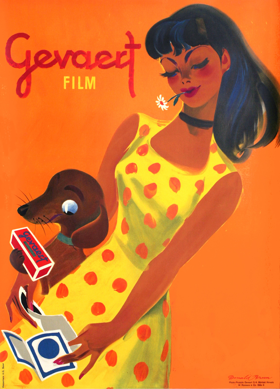 Girl and dog playfully admire photos; orange, black, brown, yellow